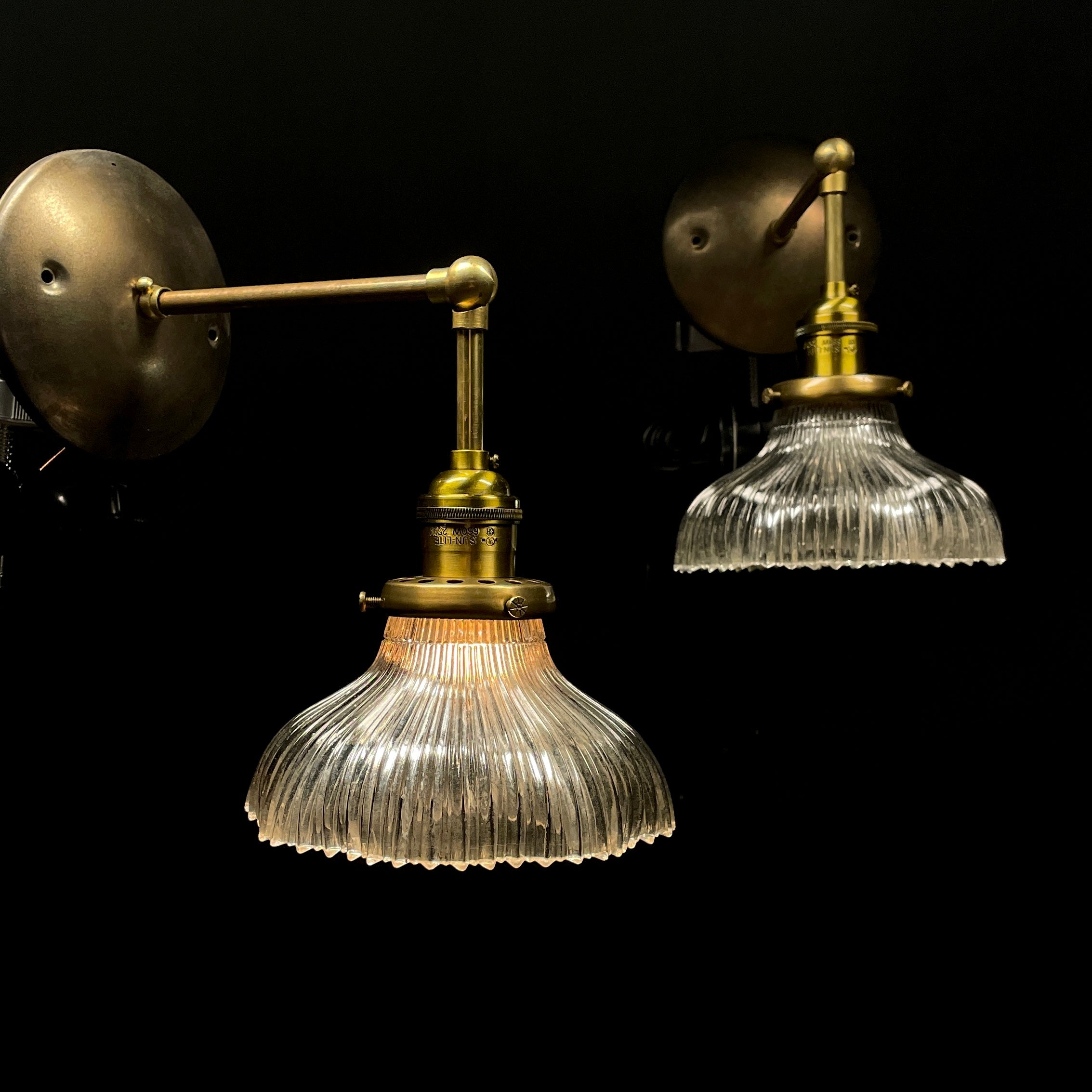 Set of Four Holophane Style Articulating Brass Sconces