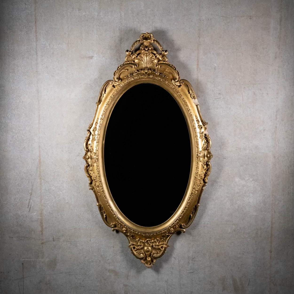 1880 French oval gilded wood mirror