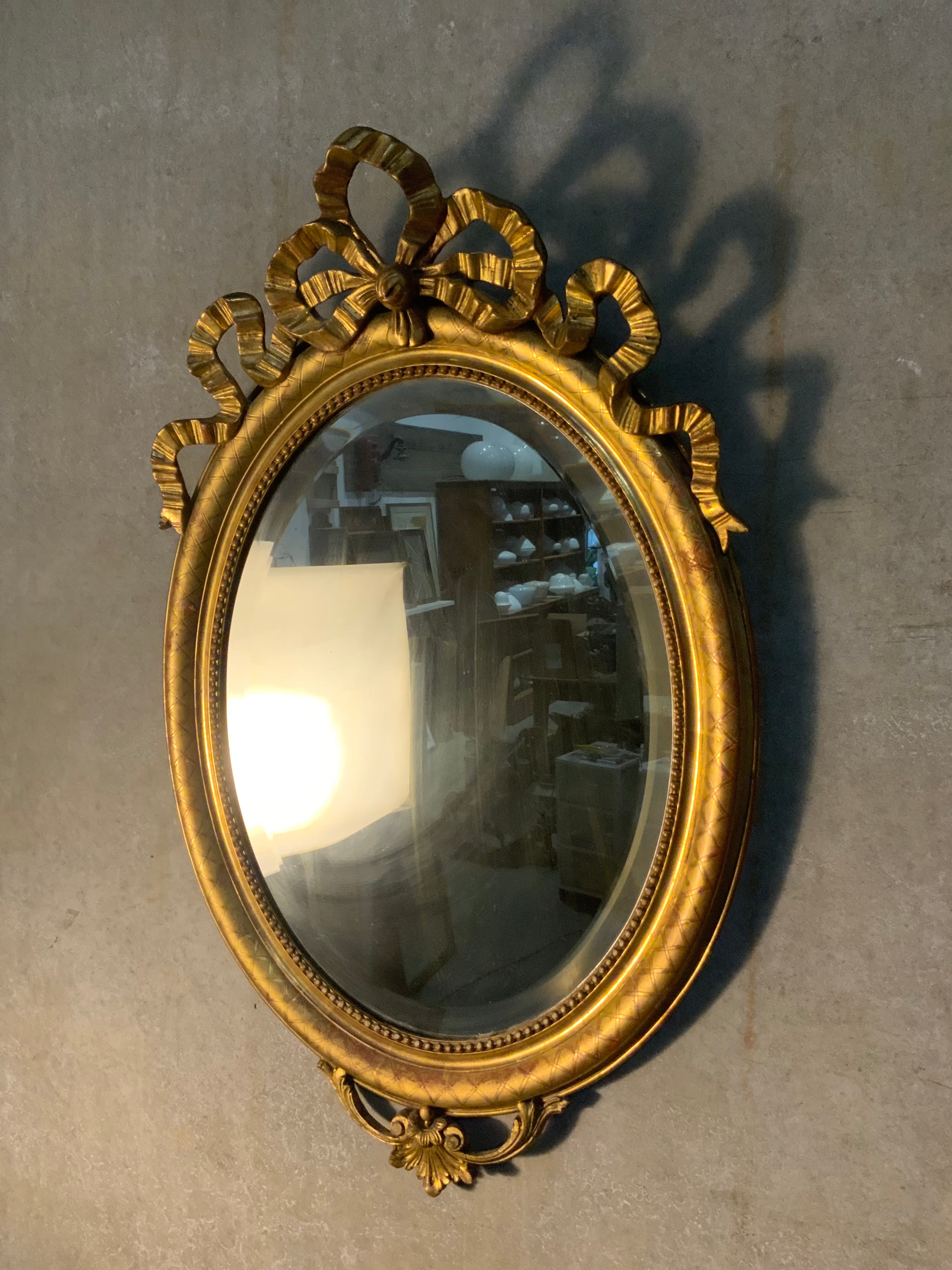 1870 French oval gilded Louis  xvi  beveled mirror | Scott Landon Antiques and Interiors.