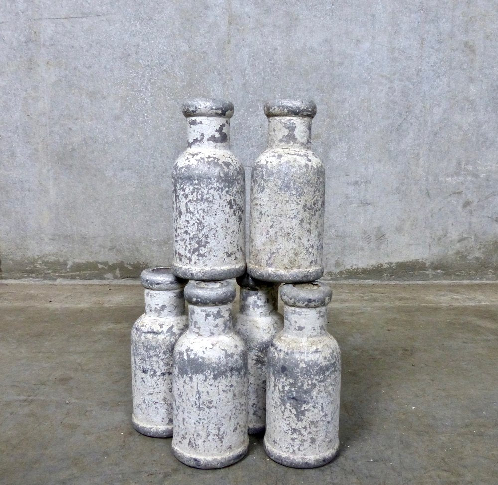 Antique Carnival Knock-Down Cast Iron Bottles | Scott Landon Antiques and Interiors.