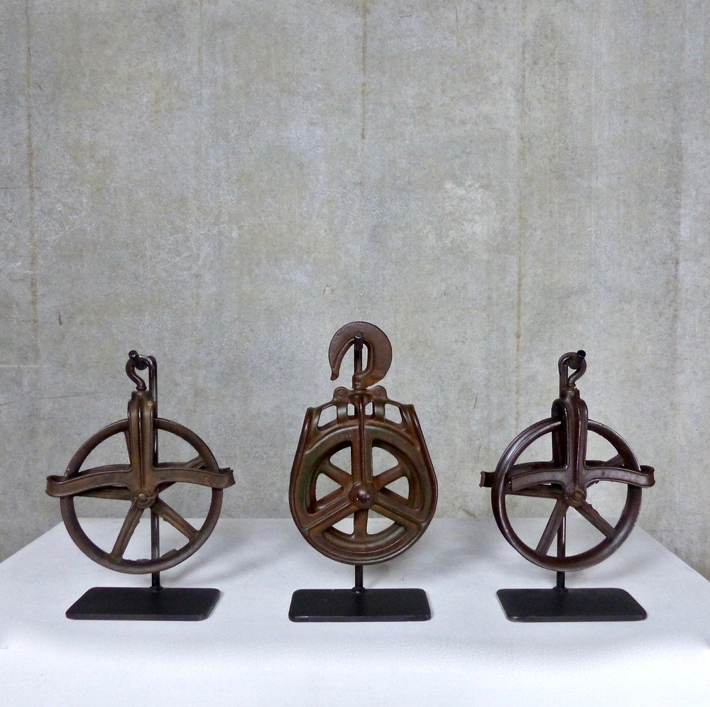 Vintage Industrial Pulleys Mounted on Stands | Scott Landon Antiques and Interiors.