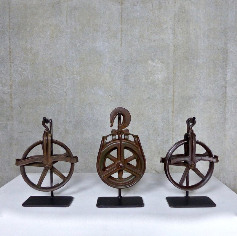 Vintage Industrial Pulleys Mounted on Stands | Scott Landon Antiques and Interiors.