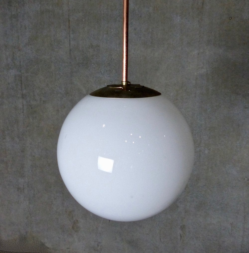 1960s Era Globe Pendant Lights on Copper Pipe | Scott Landon Antiques and Interiors.