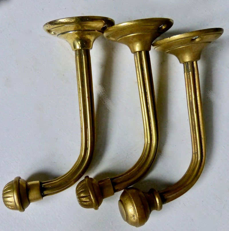 Brass 1920 wall mount towel hooks | Scott Landon Antiques and Interiors.