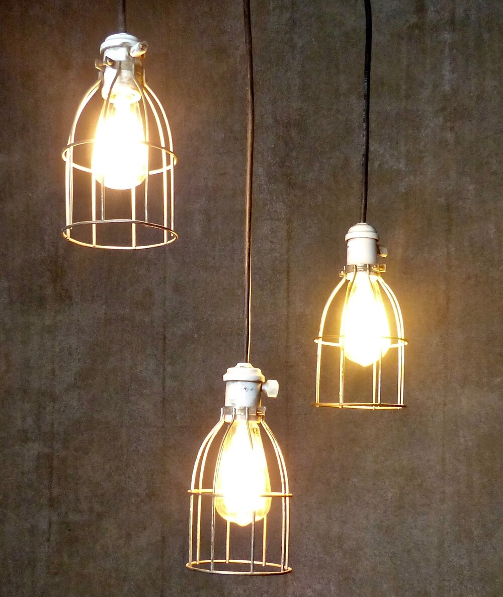 Set of Three Circa 1930 Caged Industrial Lights | Scott Landon Antiques and Interiors.